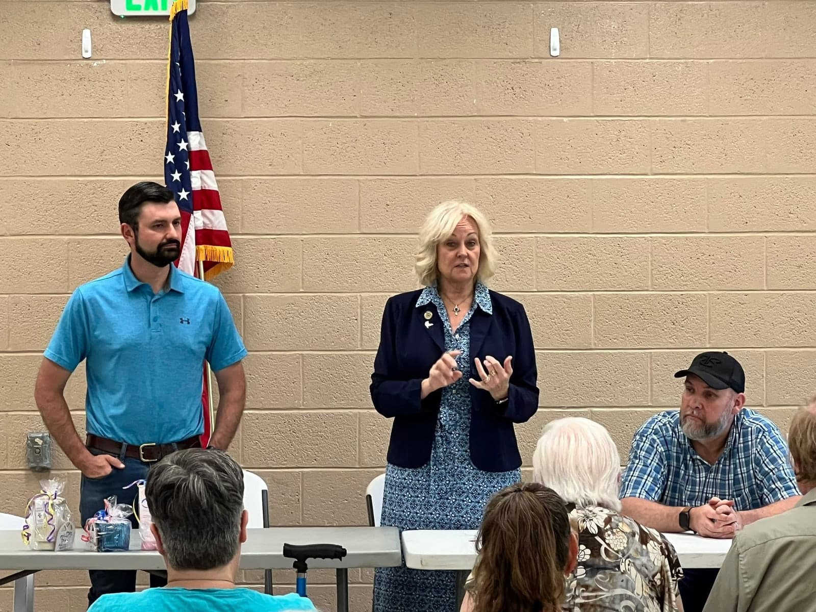 Kathy Szeliga speaking with constituents at a community hall meeting.