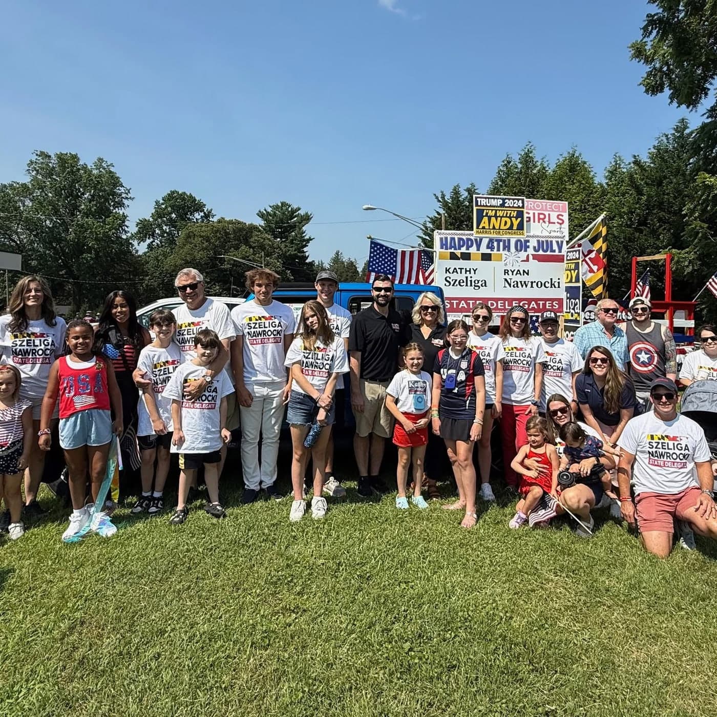 A large group of family and volunteers in Szeliga/Nawrocki shirts at a Fourth of July parade.
